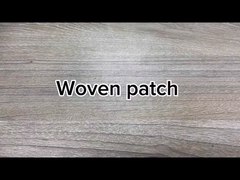 O bordado feito sob encomenda por atacado remenda o ferro em remendos tecidos para a roupa