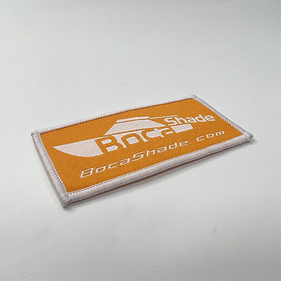 O Velcro bordado feito sob encomenda do OEM remenda o ferro da beira de Merrow em remendos tecidos