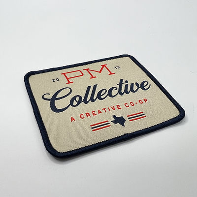 Logo Iron On Woven Patch que feito sob encomenda Emroidery lavável remenda o laser cortou a beira para a roupa